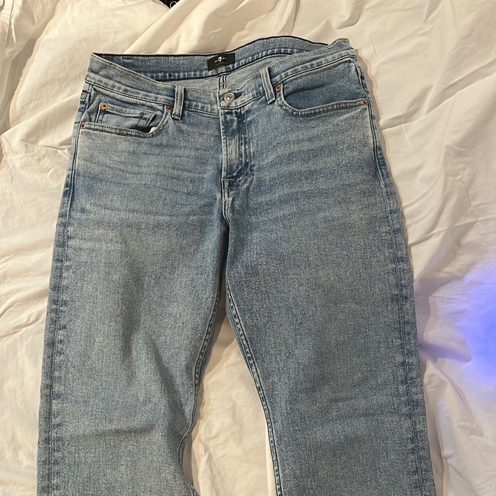 A new pair of 7 for all man kind stone washed jeans
